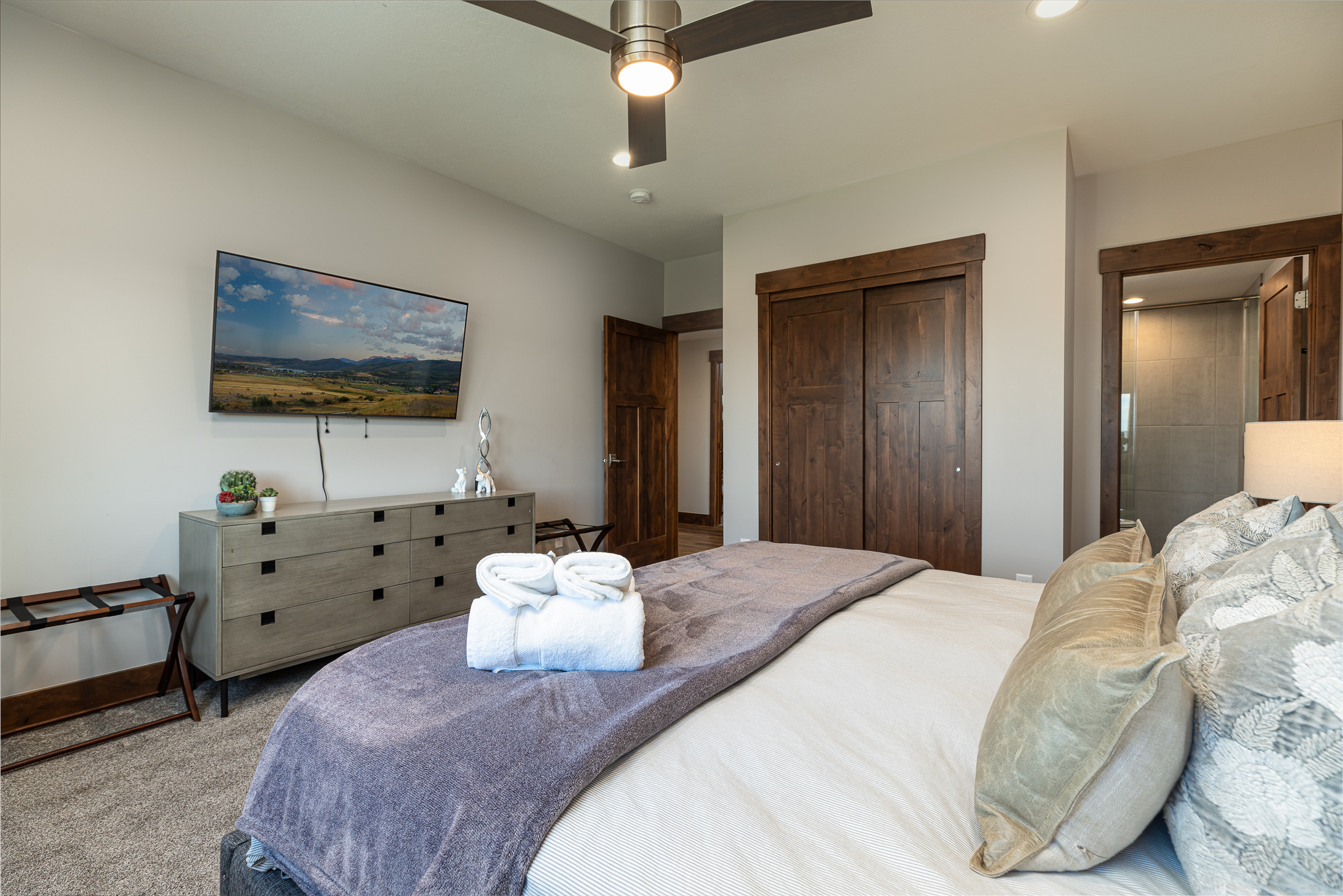 Master bedroom downstairs with king size bed