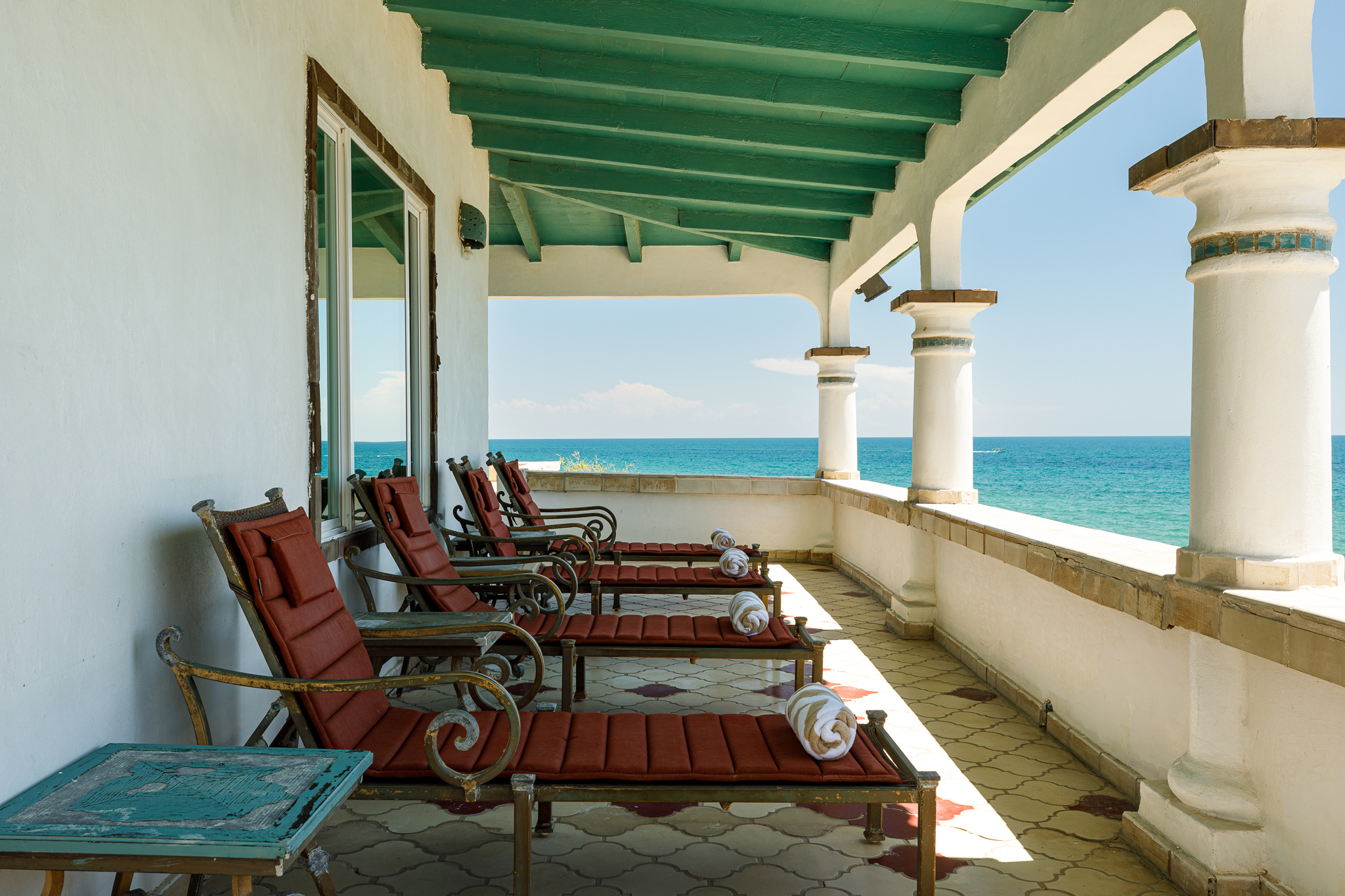Lounge chairs outside the bar area behind the Sunrise House