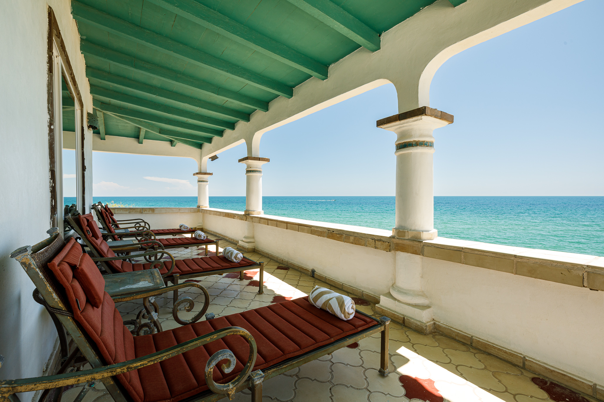 Lounge chairs outside the bar area behind the Sunrise House