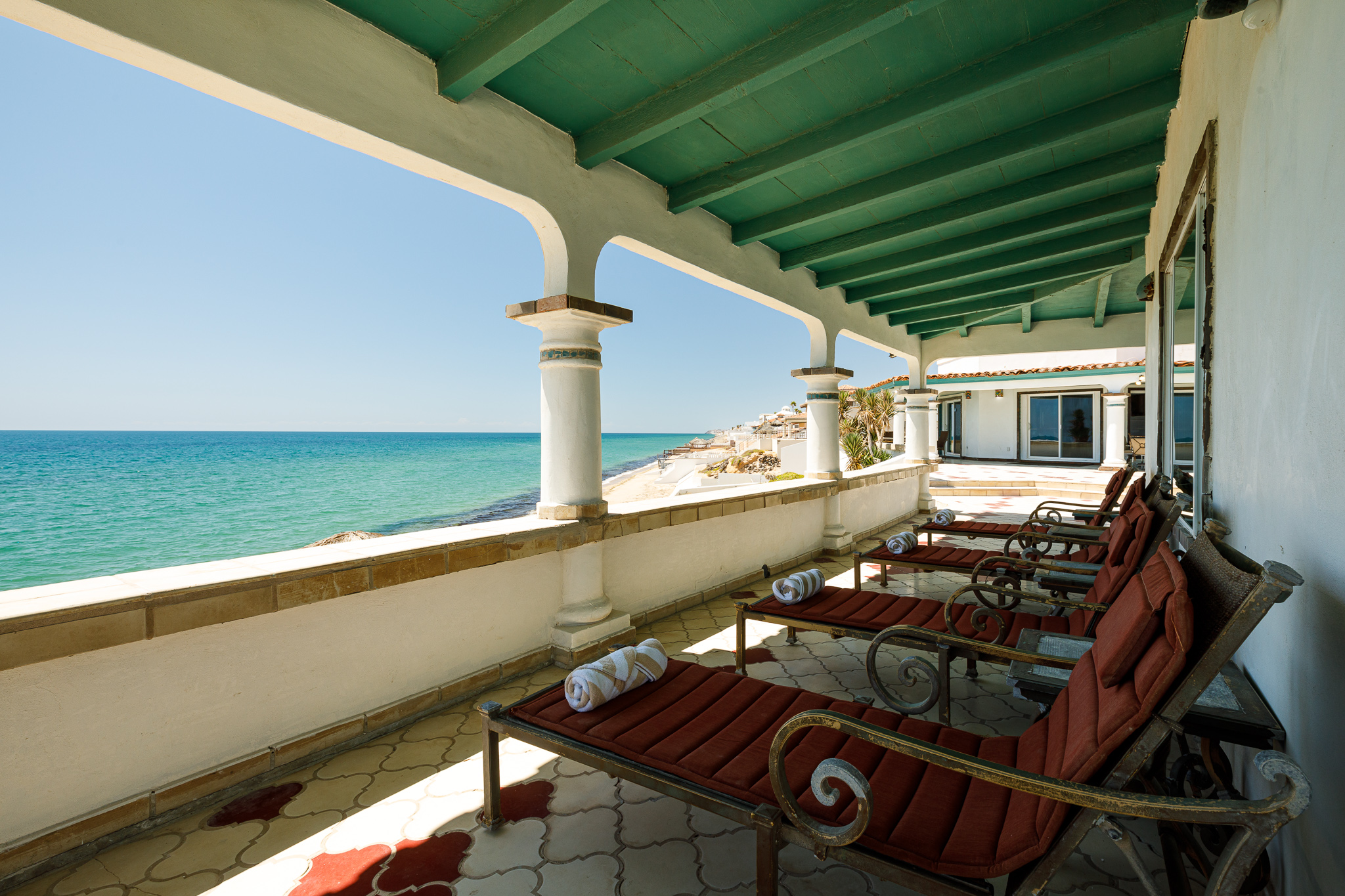 Lounge chairs outside the bar area behind the Sunrise House