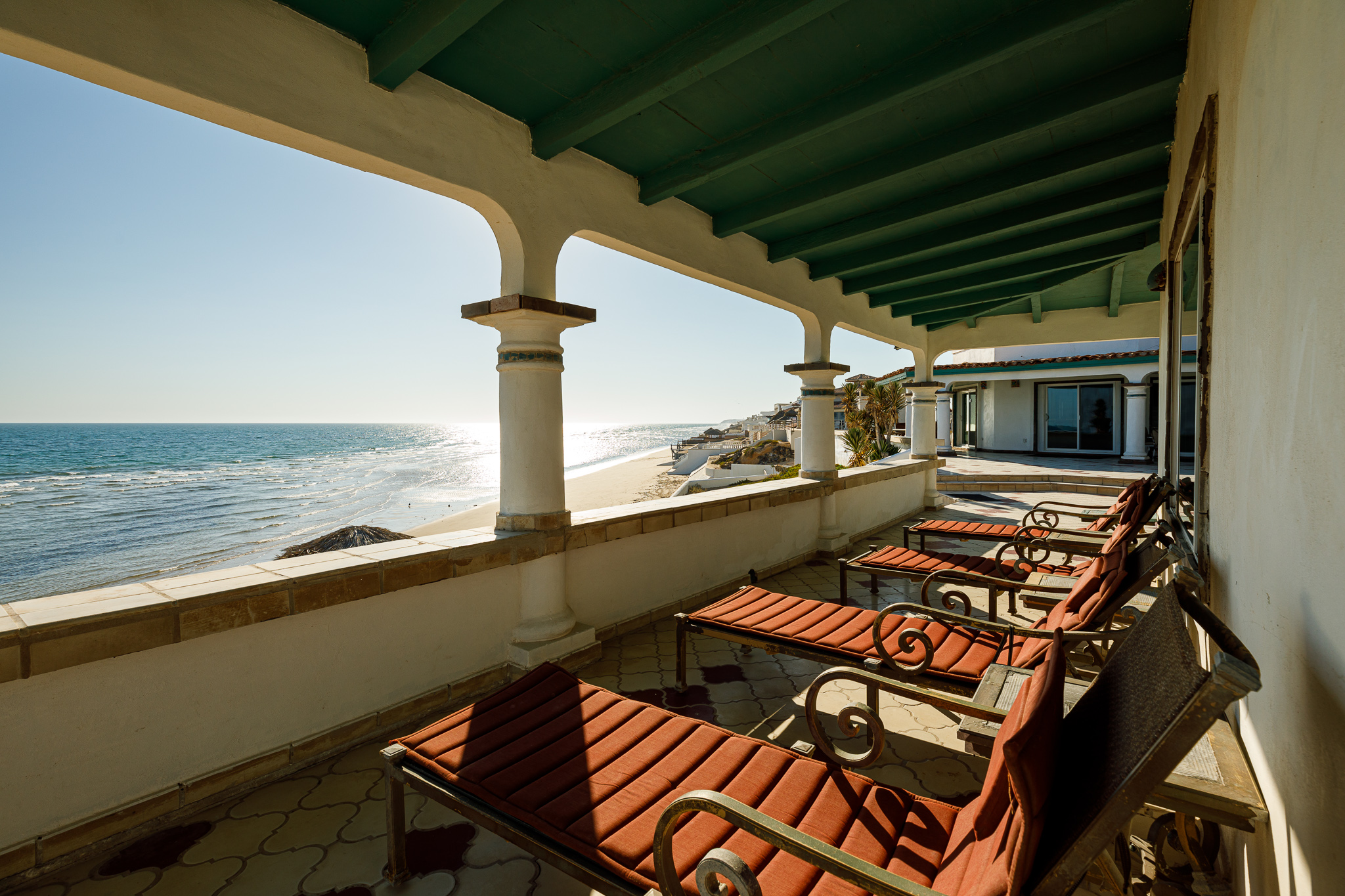 Lounge chairs outside the bar area behind the Sunrise House